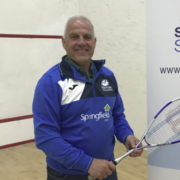 An image of David Taylor standing on a squash court promoting a junior coaching initiative at Forres Squash Club.